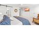 Spacious main bedroom features a sliding barn door, decorative mirror, and cozy furniture at 221 Douglas Falls Dr, Wendell, NC 27591