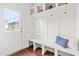 Bright mudroom features built-in bench seating, storage shelves, and hooks for coats and bags at 221 Douglas Falls Dr, Wendell, NC 27591