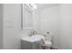Clean bathroom featuring a modern sink, fixtures, and a toilet at 226 1St St, Henderson, NC 27536