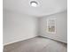 Neutral bedroom with gray vinyl floors and a window providing natural light at 226 1St St, Henderson, NC 27536