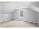 Finished attic bedroom with carpet, dormer windows, and neutral walls at 226 1St St, Henderson, NC 27536