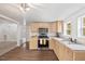 Updated kitchen features new cabinets, granite countertops, and stainless steel appliances at 226 1St St, Henderson, NC 27536