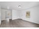 Bright and airy living room featuring wood-look floors, fresh paint, and ample natural light at 226 1St St, Henderson, NC 27536