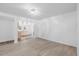 Large living room featuring wood-look floors, fresh paint, and plenty of space for entertaining at 226 1St St, Henderson, NC 27536