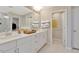 Bright bathroom with double vanity, white cabinets, and a separate shower and toilet area at 2265 Kettle Falls Sta, Apex, NC 27502