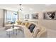 Comfortable living room with curved sofa, modern decor, and large window for natural light at 2265 Kettle Falls Sta, Apex, NC 27502