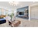Spacious living room featuring modern decor, a large TV, and an open floor plan at 2265 Kettle Falls Sta, Apex, NC 27502