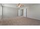 This bedroom features neutral walls, carpet and open closet doors at 2321 Stony Bottom Dr, Raleigh, NC 27610