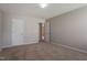 Bright bedroom featuring neutral walls and carpeting with closet access at 2321 Stony Bottom Dr, Raleigh, NC 27610