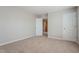 This carpeted bedroom features neutral walls and has closet space at 2321 Stony Bottom Dr, Raleigh, NC 27610
