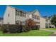 This home features a well maintained lawn, side driveway, and neutral colored siding at 2321 Stony Bottom Dr, Raleigh, NC 27610