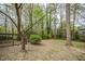 Spacious backyard surrounded by mature trees and natural foliage at 2400 Hemlock Cir, Clayton, NC 27520