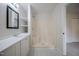 Well-lit bathroom features a shower with seat and sleek vanity with open shelving at 2400 Hemlock Cir, Clayton, NC 27520