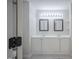 Bright bathroom featuring a double vanity with modern fixtures and framed mirrors at 2400 Hemlock Cir, Clayton, NC 27520