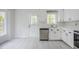 Kitchen showcasing stainless steel appliances, modern countertops, and a convenient door to the backyard at 2400 Hemlock Cir, Clayton, NC 27520