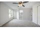 Bright main bedroom with carpet floors and a view of the ensuite bathroom at 2400 Hemlock Cir, Clayton, NC 27520