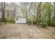 View of the storage shed located in the backyard with a gated fence area at 2400 Hemlock Cir, Clayton, NC 27520