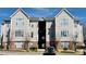 Attractive apartment building featuring light siding, brick accents, and manicured landscaping at 2521 Friedland Pl # 201, Raleigh, NC 27617