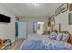 Comfortable bedroom with closet, TV, and ensuite bathroom featuring decorative touches and ample natural light at 2521 Friedland Pl # 201, Raleigh, NC 27617