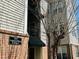 Exterior shot of a building at 2521 Friedland Place in gray and tan with visible address sign at 2521 Friedland Pl # 201, Raleigh, NC 27617