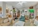 Cozy living room featuring plush seating, vintage decor, and access to the kitchen and vibrant bathroom at 2521 Friedland Pl # 201, Raleigh, NC 27617