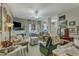 Inviting living room featuring neutral walls, ceiling fan, fireplace, and comfortable seating arrangement at 2521 Friedland Pl # 201, Raleigh, NC 27617