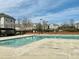 Community pool with ample space, lounge chairs, and well-maintained grounds at 2521 Friedland Pl # 201, Raleigh, NC 27617