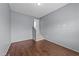 Bedroom with wood-look flooring and stairwell at 265 Beckwith Ave, Clayton, NC 27527