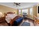Spacious primary bedroom with hardwood floors, natural light, and a ceiling fan at 265 Beckwith Ave, Clayton, NC 27527