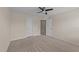 Bedroom with carpet floors, ceiling fan, neutral paint and multiple doors at 265 Beckwith Ave, Clayton, NC 27527