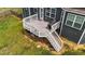 This outdoor deck area with its grill is perfect for relaxing and entertaining at 265 Beckwith Ave, Clayton, NC 27527