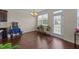 A dining area with hardwood floors and natural light shining through sliding glass doors at 265 Beckwith Ave, Clayton, NC 27527