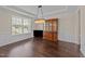 Elegant dining room with hardwood floors, wainscoting, and a decorative chandelier at 265 Beckwith Ave, Clayton, NC 27527