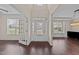 Bright foyer with hardwood floors, transom windows, and elegant trim at 265 Beckwith Ave, Clayton, NC 27527