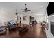 Open-concept living room with fireplace, hardwood floors, and seamless flow to kitchen at 265 Beckwith Ave, Clayton, NC 27527