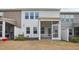 Backyard showcasing the porch, landscaping, and the exterior of the home at 272 Hiking Hill Ln, Garner, NC 27529