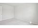 Neutral bedroom featuring carpeted floors, white walls, and a closet door at 272 Hiking Hill Ln, Garner, NC 27529