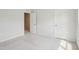 Bedroom with neutral carpet and white walls, showcasing closet and doorway at 272 Hiking Hill Ln, Garner, NC 27529