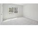 Bedroom with carpet, natural light, and views of the neighborhood at 272 Hiking Hill Ln, Garner, NC 27529