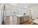 Modern kitchen featuring stainless appliances and fixtures, a large island and open floorplan at 272 Hiking Hill Ln, Garner, NC 27529