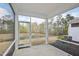 Screened porch overlooking a pond, offering a peaceful outdoor space at 272 Hiking Hill Ln, Garner, NC 27529