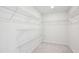 Spacious walk-in closet equipped with white wire shelving for organized storage at 272 Hiking Hill Ln, Garner, NC 27529