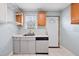 Functional kitchen features a stainless sink, updated counters, and a dishwasher with an outside door at 2724 N Roxboro St, Durham, NC 27704