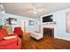 Inviting living room with fireplace, hardwood floors, and soothing blue walls at 2724 N Roxboro St, Durham, NC 27704