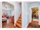 Bright living room featuring hardwood floors, a ceiling fan, and comfortable furniture in a well-lit space at 2724 N Roxboro St, Durham, NC 27704