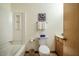 Bathroom featuring a tub and shower combination, toilet, and vanity at 308 Cedarwood Ln, Carrboro, NC 27510