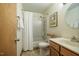 Bathroom featuring a tub with shower, vanity with sink and a medicine cabinet at 308 Cedarwood Ln, Carrboro, NC 27510