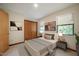 Comfortable bedroom with two large windows, closet and modern decor at 308 Cedarwood Ln, Carrboro, NC 27510