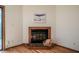 Close up view of a fireplace with a stone hearth and wood mantle at 308 Cedarwood Ln, Carrboro, NC 27510