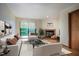 Bright living room featuring a fireplace, a sliding glass door to a deck, and comfortable seating at 308 Cedarwood Ln, Carrboro, NC 27510